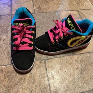Heeleys girls size 5 good condition my daughter outgrew them!